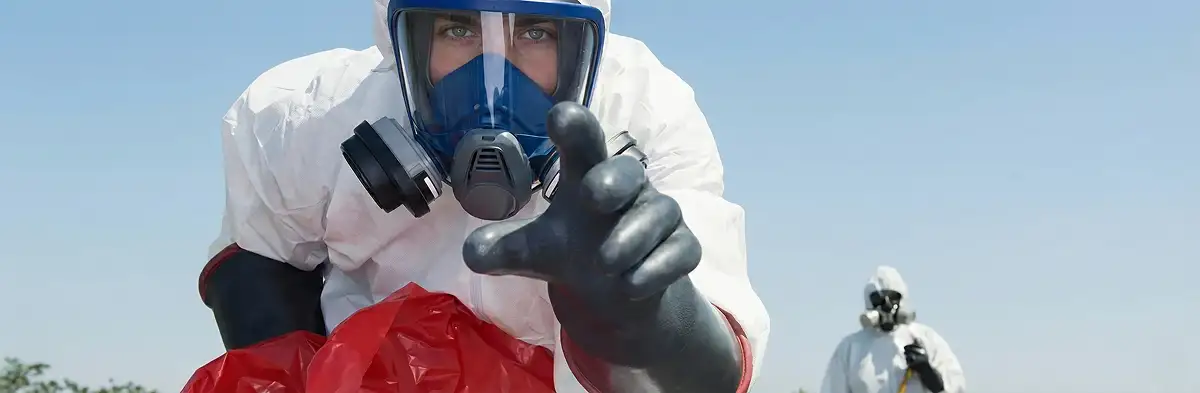 sewage clean up technician wearing protective gear handling biohazard materials in Myrtle Beach, SC