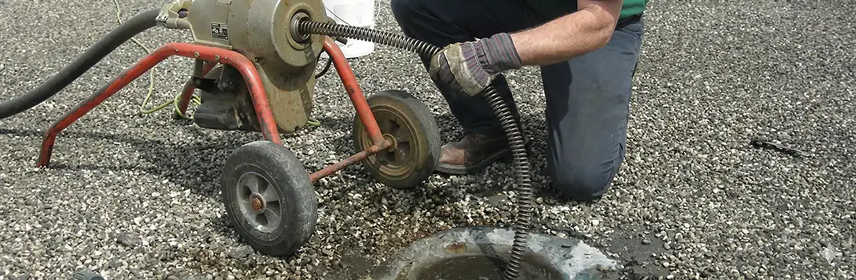 sewer rodding technician actively removing blockages from a sewer line in Myrtle Beach, SC